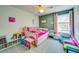 Adorable bedroom featuring pastel colors, playful decor, and comfortable furnishings at 5703 New Paris Way, Ellenton, FL 34222