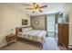 Comfortable bedroom with neutral tones, stylish furniture, and ample natural light at 5703 New Paris Way, Ellenton, FL 34222