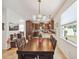 Open dining area with modern lighting and a view into the kitchen, perfect for Gathering meals at 5703 New Paris Way, Ellenton, FL 34222