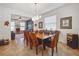 Well-lit dining area featuring stylish furnishings and an open layout with neutral color palette and modern lighting at 5703 New Paris Way, Ellenton, FL 34222