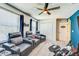 Home theater featuring comfortable seating and a ceiling fan at 5703 New Paris Way, Ellenton, FL 34222