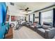 Home theater featuring comfortable seating and a ceiling fan at 5703 New Paris Way, Ellenton, FL 34222