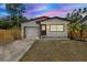 Charming home with a well-maintained lawn, fresh exterior paint and an attached garage at 6220 Pershing Ne St, St Petersburg, FL 33702