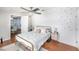Charming bedroom with gold bed frame, ceiling fan, and bright natural light at 6801 16Th N St, St Petersburg, FL 33702