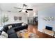 Inviting living room with a large sectional, stylish decor, and hardwood floors at 6801 16Th N St, St Petersburg, FL 33702