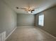 Bedroom offering neutral walls, tile flooring and natural light from the large window at 13344 Great Plains S Dr, Riverview, FL 33579