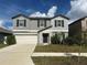 Charming two-story home with a two-car garage and well-maintained landscaping at 13344 Great Plains S Dr, Riverview, FL 33579