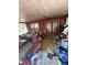 Back porch view with debris and trash scattered throughout the entire space at 8731 N 26Th St, Tampa, FL 33604