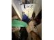 This bathroom features a sink and vanity with a small mirror, but the room is filled with clutter at 8731 N 26Th St, Tampa, FL 33604