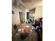 View of bedroom with connected bath & doorway; space is cluttered, but shows layout at 8731 N 26Th St, Tampa, FL 33604