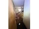 Bedroom view of a dresser and a ceiling fan but the room is filled with trash and clutter at 8731 N 26Th St, Tampa, FL 33604