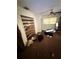 Bedroom needing cleaning and repair, featuring an open closet and ceiling fan at 8731 N 26Th St, Tampa, FL 33604