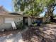 Exterior shot of a home requiring landscaping and exterior repairs to enhance curb appeal at 8731 N 26Th St, Tampa, FL 33604