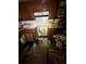 View of the kitchen, which features wood cabinets and tile backsplash but suffers from visible mold and clutter at 8731 N 26Th St, Tampa, FL 33604