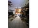 Open-concept living area needing renovation, showcasing fireplace and view into adjacent room at 8731 N 26Th St, Tampa, FL 33604