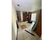 Room features checkered floors, shelves, and window but has trash and debris scattered across the floor at 8731 N 26Th St, Tampa, FL 33604