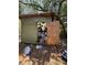 Shed filled with trash and debris with damaged walls and roof at 8731 N 26Th St, Tampa, FL 33604