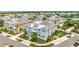 A high angle view of neighborhood featuring charming light blue homes near a pond and lake at 283 Saint Lucia Dr # 202, Bradenton, FL 34209