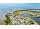 Breathtaking aerial view featuring charming homes, tranquil lake, and scenic waterfront location at 283 Saint Lucia Dr # 202, Bradenton, FL 34209