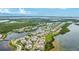 Breathtaking aerial view of a waterfront community with lush landscaping and stunning water views at 283 Saint Lucia Dr # 202, Bradenton, FL 34209