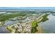 Stunning aerial view featuring waterfront homes, tranquil lake, lush landscaping, and beautifully designed community at 283 Saint Lucia Dr # 202, Bradenton, FL 34209