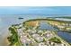 Breathtaking aerial view featuring charming homes, tranquil lake, and scenic waterfront location at 283 Saint Lucia Dr # 202, Bradenton, FL 34209