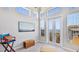 Living room with high ceilings and balcony access with water view at 283 Saint Lucia Dr # 202, Bradenton, FL 34209