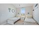 Coastal-themed bedroom with two twin beds, decorative oars and beach-inspired decor at 283 Saint Lucia Dr # 202, Bradenton, FL 34209