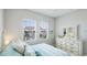 Bedroom featuring coastal decor and an exterior view of the neighborhood at 283 Saint Lucia Dr # 202, Bradenton, FL 34209