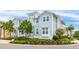 Beautiful view of a two-story home featuring light blue siding and manicured landscaping on a sunny day at 283 Saint Lucia Dr # 202, Bradenton, FL 34209