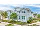 Beautiful view of a two-story home featuring light blue siding and manicured landscaping on a sunny day at 283 Saint Lucia Dr # 202, Bradenton, FL 34209