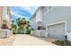 Attached two-car garage with white door and neutral siding, set within a well-maintained community at 283 Saint Lucia Dr # 202, Bradenton, FL 34209