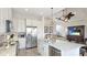 Modern kitchen with stainless steel appliances, granite countertops, and island seating is a chef's dream at 283 Saint Lucia Dr # 202, Bradenton, FL 34209