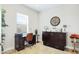 Office featuring desk with chair and convertible Murphy bed behind cabinet at 283 Saint Lucia Dr # 202, Bradenton, FL 34209