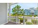 A view from the porch of a charming light blue two-story home with well-maintained landscaping at 283 Saint Lucia Dr # 202, Bradenton, FL 34209