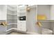 Custom walk-in closet with built-in shelves, drawers, and ample storage space for a dream wardrobe at 283 Saint Lucia Dr # 202, Bradenton, FL 34209