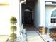 Inviting front entrance with a landscaped walkway and an arched doorway at 30643 Tremont Dr, Wesley Chapel, FL 33543