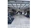 Spacious garage featuring a workstation, tools, and ample room for multiple vehicles or hobbies at 30643 Tremont Dr, Wesley Chapel, FL 33543