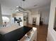 Open living space boasts high ceilings, wood floors, and a stylish light fixture at 30643 Tremont Dr, Wesley Chapel, FL 33543