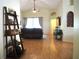 Bright living room with hardwood floors, open floor plan, and sliding glass door at 30643 Tremont Dr, Wesley Chapel, FL 33543