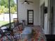 Covered patio with comfortable seating and a view of the backyard, perfect for relaxing at 30643 Tremont Dr, Wesley Chapel, FL 33543