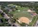 Panoramic aerial view of a baseball field, tennis courts and other recreational facilities in Brandon Park at 505 Hedge Row Rd, Brandon, FL 33510