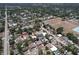 Aerial view of a single-Gathering home nestled in a tranquil Brandon Park neighborhood near local amenities at 505 Hedge Row Rd, Brandon, FL 33510