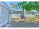 View of backyard from a rear corner showing storage shed and AC unit at 505 Hedge Row Rd, Brandon, FL 33510