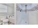 Bright bathroom featuring a tub, toilet, and a stand up shower with rainfall showerhead at 505 Hedge Row Rd, Brandon, FL 33510