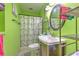 Bathroom in green with a shower and sink at 505 Hedge Row Rd, Brandon, FL 33510