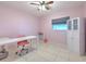 Bedroom in pink with a desk and storage at 505 Hedge Row Rd, Brandon, FL 33510