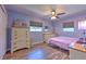 Bedroom with hardwood floors, ceiling fan, and dresser storage at 505 Hedge Row Rd, Brandon, FL 33510