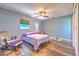 Comfortable bedroom with hardwood floors, ceiling fan, and window views at 505 Hedge Row Rd, Brandon, FL 33510