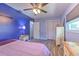 Bedroom with hardwood floors, ceiling fan, and windows for natural light at 505 Hedge Row Rd, Brandon, FL 33510